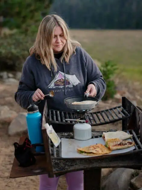 cooking quesadillas on camp fire